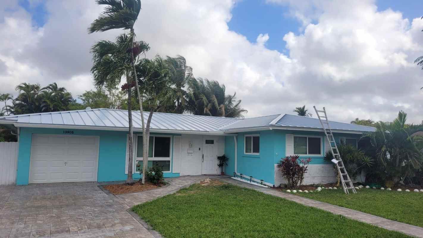 Roofer installing a new roof in Miami Springs, FL