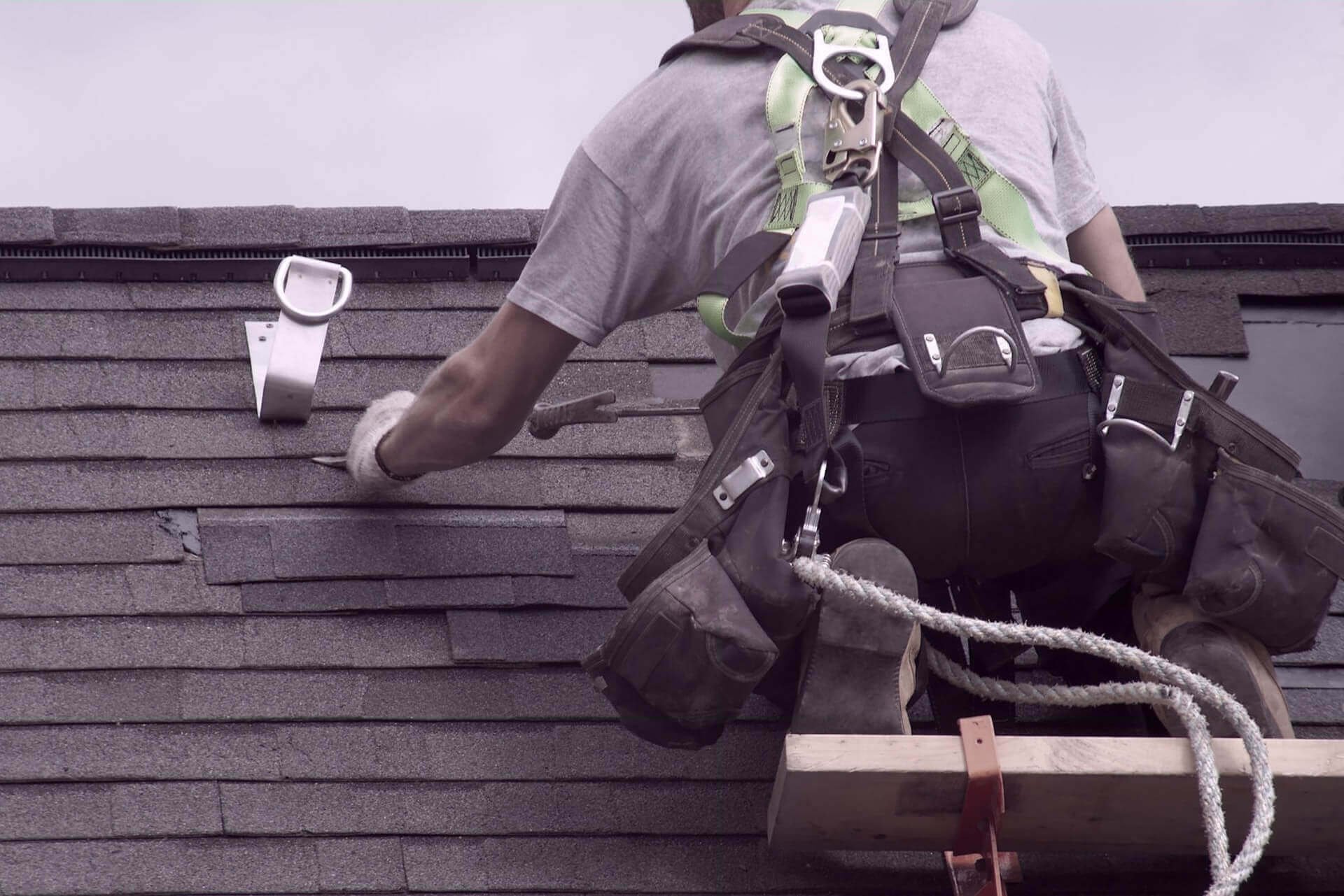 Roofer installing a new roof in Fayetteville, NC